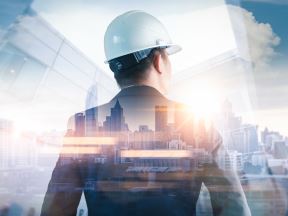 architect-with-city-skyline-overlay-getty-1001487764.jpg