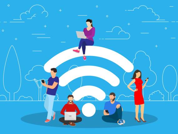 Ljudi sa uređajima oko Wi-Fi znaka